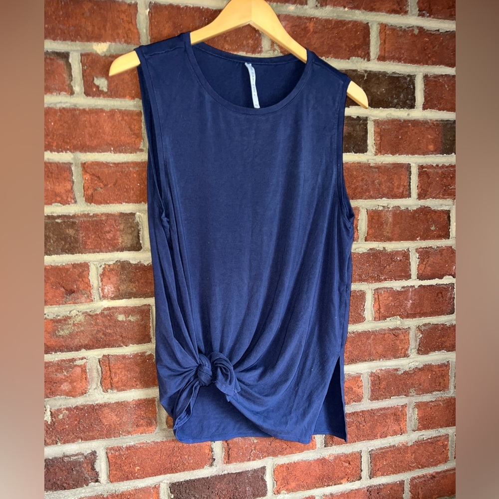 Fabletics navy sleeveless top with bottom slits at hem ( ties on the side)